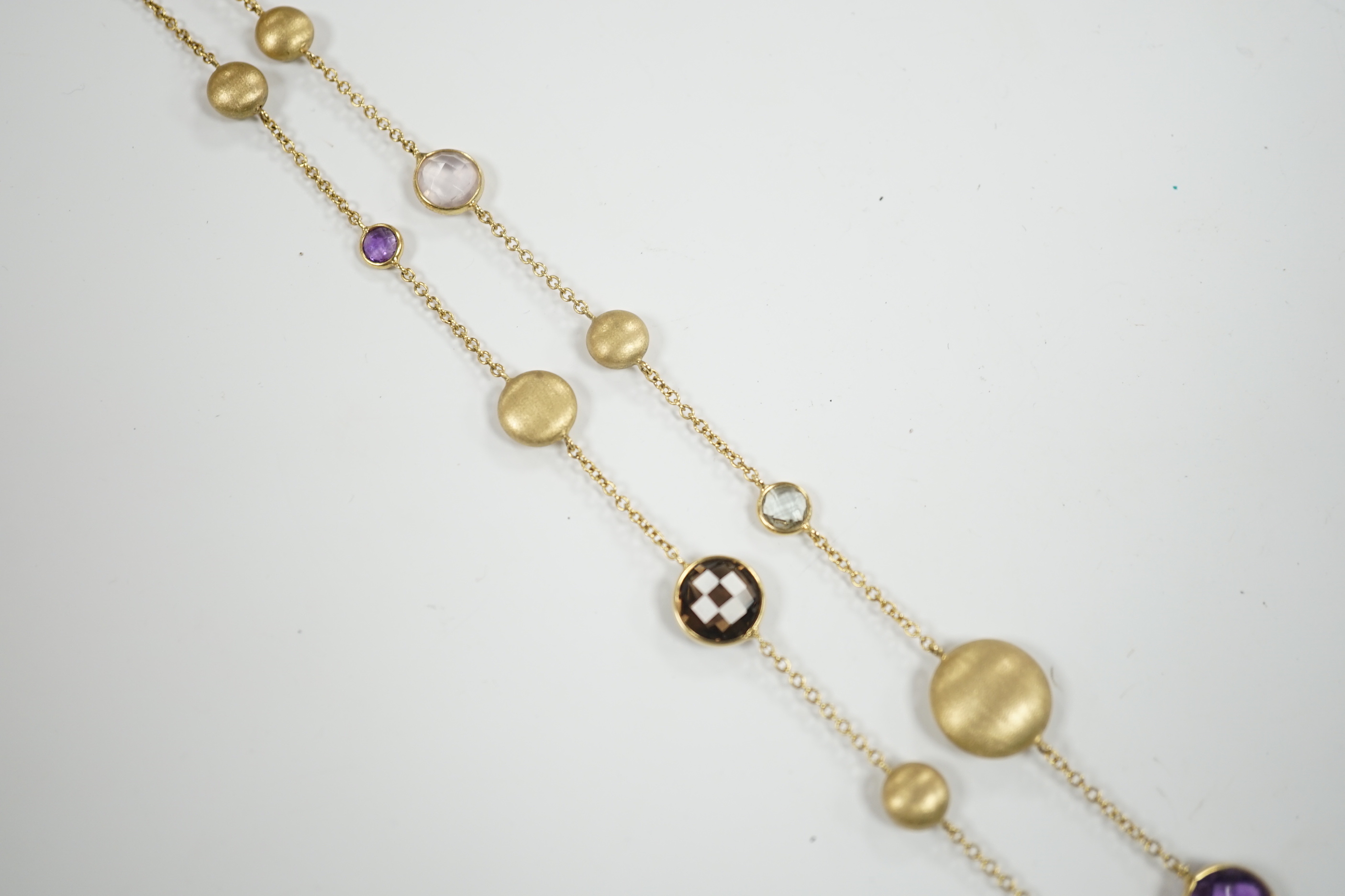 A modern Italian 9ct gold pebble and graduated multi gem set necklace, 68cm, gross weight 16 grams.